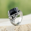 Detail of a vintage titanium steel ring featuring a square blue goldstone inlay and textures - US 7 / Silver Blue Sandstone