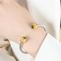 Silver cable cuff bracelet with gold end caps and sparkling green zircon stones - Z059-Green Zirconia Single Layer