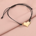Detail of adjustable black woven bracelet with polished gold heart pendant on pink silk - 18K Gold (MP592)