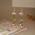 Close-up of Oriental style earrings with green bamboo beads and vintage gold dragonfly - Dragonfly Bamboo Green Joint Red White Beads Style (E6418)