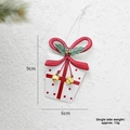 Christmas tin white gift box ornament with red bow and gold bells on snowy background - White Gift Box