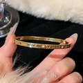 [10] Gold Roman Numerals Set With Diamonds