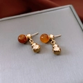 Macro shot of amber acrylic bead and gold gourd pendant with vintage metallic texture - Gold-Coffee (Silver Pin)