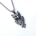 Silver stainless steel owl pendant necklace with Celtic knot design on white background - Owl + Stainless Steel Chain