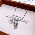 Close-up of silver horse pendant with chain tassels on black cord necklace detail - Silver Necklace (With Black Rope)