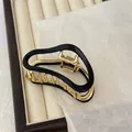Minimalist cloud-shaped gold metal hair claw clip with black glossy enamel finish - Bright Black