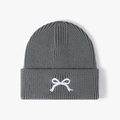 Dark grey knitted beanie with white bow embroidery and chunky ribbed texture - Dark Gray