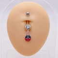 Close-up of stainless steel belly ring with red ladybug pendant on navel model - Ladybug Style