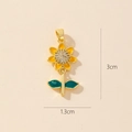 Golden flower pendant with green leaves and inlaid zircons on a beige background - 0372-4 Enamel Sunflower Pendant (3x1.3cm)