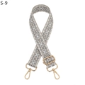 Close-up of adjustable beige geometric diamond pattern strap with gold metal hooks - S-9 Gray