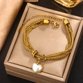 Double-layered gold twisted chain bracelet with heart-shaped shell pendant on jewelry box - Gold Shell Heart Pendant (B-46)