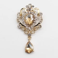 Vintage golden crystal brooch with teardrop champagne rhinestone and floral design - Champagne