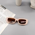Detailed top view of rectangular matte pink kids sunglasses on a stylish background - Pink