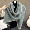 Detailed view of green knitted scarf texture with white contrast stitching edge - Seaweed Green