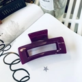 Macro detail of purple rectangular acrylic hair claw clip with glossy finish - Jelly Purple