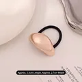 Minimalist rose gold metallic hair tie with a sleek curved design and black elastic band - Large Oval Rose Gold