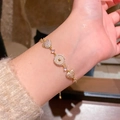 Elegant gold bracelet with heart and circle pendants featuring zircon and white stone - S741 Gold