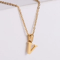 Macro shot of 18k gold plated stainless steel letter V pendant on a minimalist surface - Letter V