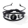 Multilayer black leather bracelet featuring a silver-toned metal charm with the letter F - Letter-F