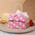Detail of pink polka dot wedding favor box with pearl handle and satin ribbon bow - Rose Red With Dots