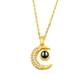 Golden moon pendant necklace with white crystals and black projection stone - Moon Gold
