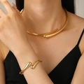Polished gold geometric choker and matching open cuff bracelet on female model - 10 2-Piece Set (Choker 9065 + Bangle 9449)