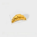 Macro detail of gold croissant brooch showing ribbed texture and 32mm stainless steel size - NXBE01 (Croissant Shape) / Gold