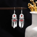 Bohemian silver earrings with red beads and long metal tassels on a wooden stand - Red Silver (E6131-1)
