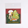 Christmas card with puppy decorating tree and Merry Christmas text in clear packaging - Christmas Dog (With Envelope)