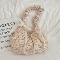 Detail of floral tote bag showing pleated handles and white lace bow decoration - Blue Floral
