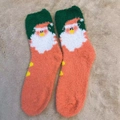 Santa Claus themed fuzzy coral fleece socks in vibrant orange, green, and white colors - One Size / New Orange Santa