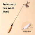 Solid wood teaser wand for cats featuring natural white feathers and flexible metal rod - Spring Wood Handle Teaser / Spring Wood Wand With White Feather Head