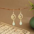 Detail of golden bamboo leaf ring earrings with pale green teardrop jade pendants - Bamboo Circle Water Drop (E6452)