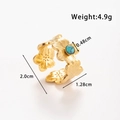 Gold stainless steel flower ring featuring a round green turquoise stone inlay - Four Petal Flower Turquoise Open Style (TR061-Blue)