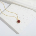 Exquisite gold necklace with round red gemstone pendant and white zircon accents - Red