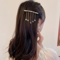 Detail of gold hair clip with crystal teardrops and shimmering tassels on dark brown hair - 53# Clear Gold Crystal Tassel Hair Clip