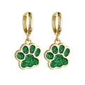 Chic gold hoop earrings featuring green glitter paw print pendants on white background - Green