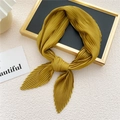 Elegant mustard yellow pleated neck scarf with accordion texture displayed on black tray - Earthy Yellow