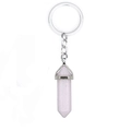Pink natural crystal hexagonal column keychain with silver metal ring on white background - Rose Quartz
