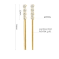 Detail of 90mm long stainless steel tassel earrings with 18K gold PVD and zircon - 18K Gold / Gold