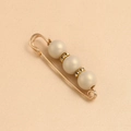 Detailed macro of gold safety pin brooch featuring three pearls and sparkling rhinestones - 5.8*1.5cm / Milk Tea