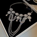 Detailed view of silver crystal floral pendant necklace with tassels in a premium gift box - Silver Rhinestone Flower Water Drop Style