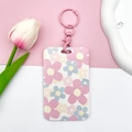 Vertical floral ID card holder with pink wristlet keychain and flower patterns - Pink Handcuff Buckle / Pale Blue