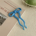 Close-up of a blue ballet-style bow hair pin resting on a book for aesthetic styling - 10.5cm / Sky Blue