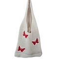 Dettaglio della borsa in maglia traforata con motivi di farfalle rosse vivaci - Beige