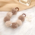 Brown and beige plush ball phone strap with iridescent bone charm on white fur - Khaki Style (K939)