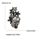 Golden vintage floral brooch with black crystals, 8.0cm height and 5.0cm width specs - Black