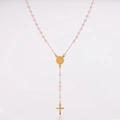 Close-up of pink crystal beads and golden Saint Benedict medal on a rosary necklace - Pink