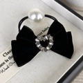 Detail of black velvet bow hair tie with rhinestone heart and white faux pearl accent - Heart Rhinestone Style