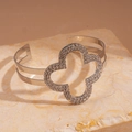 Macro view of silver open cuff bracelet with crystal-paved clover and double bands - Silver